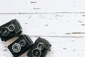 Collection old vintage retro photo cameras on white wooden background. top view, medium format Royalty Free Stock Photo