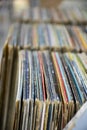 Collection of old vinyl record lps with sleeves in storage shelf