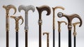 Collection of Ornate Walking Canes with Gold and Gemstone Details on a White Background Royalty Free Stock Photo