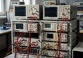 A collection of oscilloscopes, multimeters, and signal generators in a laboratory setting, connected Royalty Free Stock Photo