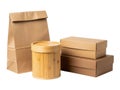 Collection of packaging materials including paper bag, bamboo container, and cardboard boxes Royalty Free Stock Photo
