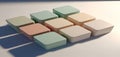 A collection of pastel colored square boxes arranged in a grid casting long shadows on a white surface Royalty Free Stock Photo