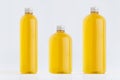 Collection plastic transparent bottles - tall, low and thick with orange drink, cooking oil or cosmetic produce, silver cap mockup