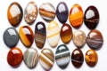 collection of polished pocket stones on white Royalty Free Stock Photo