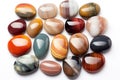 collection of polished pocket stones on white Royalty Free Stock Photo