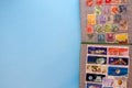 A collection of post stamps in two post albums on blue background. Top view. Stamps collecting hobby Royalty Free Stock Photo