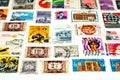 collection of Postage stamps from different countries and times background on a white background, old vintage retro Royalty Free Stock Photo