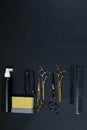 Collection of professional hair dresser tools arranged on dark background Royalty Free Stock Photo