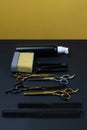 Collection of professional hair dresser tools arranged on dark background Royalty Free Stock Photo