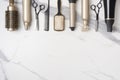 Collection of professional hair dresser tools arranged on marble background Royalty Free Stock Photo