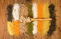 Collection raw cereal beens on wooden background. Couscous, yell