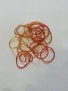 A collection of red and orange rubber bands Royalty Free Stock Photo