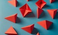 collection red paper triangles arranged in grid-like pattern against blue background. Royalty Free Stock Photo