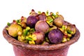 Collection of ripe mangosteen fruit in a rattan basket Royalty Free Stock Photo