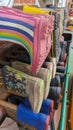 A collection of rubber Wellington boots organised on a rack outside nursery Royalty Free Stock Photo