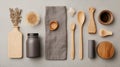 A collection of rustic kitchen items featuring wooden utensils a ceramic jar and decorative elements on a neutral backdrop Royalty Free Stock Photo