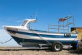 Fishing boat on a pebble beach