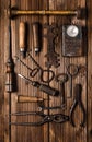 Collection of rusty tools in vintage style on wooden background