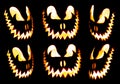 Collection of scary Halloween pumpkin Jack o lantern faces glowing red and yellow Royalty Free Stock Photo