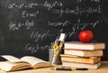 Collection of School Supplies and Math Formulas in Classroom Setting on Desk During Study Time Royalty Free Stock Photo