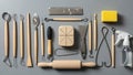 A collection of sculpting tools neatly arranged on a gray surface Royalty Free Stock Photo