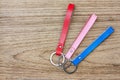 Collection set of colorful Leather key chain on wooden background. Royalty Free Stock Photo