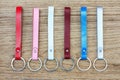 Collection set of colorful Leather key chain on wooden background. Royalty Free Stock Photo