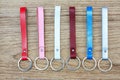 Collection set of colorful Leather key chain on wooden background. Royalty Free Stock Photo