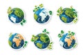 Collection set of six stickers of earth globes featuring different continents with green leaves for environmental Royalty Free Stock Photo