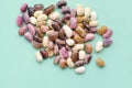 Collection set of various dried kidney legumes haricot beans close up isolated on blue background. Healthy food. Royalty Free Stock Photo