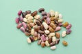 Collection set of various dried kidney legumes haricot beans close up isolated on blue background. Healthy food. Royalty Free Stock Photo