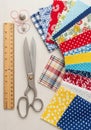 Collection of sewing tools and materials on a light surface. Includes large metal scissors and a Royalty Free Stock Photo