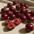 A collection of shiny, deep red cherries scattered on a textured surface. Some cherries Royalty Free Stock Photo