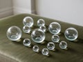 A collection of shiny glass balls arranged on a green surface. Royalty Free Stock Photo