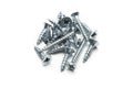 Collection of silver screws arranged on a white background for construction tasks Royalty Free Stock Photo