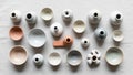 Collection of small ceramic objects arranged on a light fabric Royalty Free Stock Photo