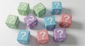Assortment of colorful cubes with question marks on a white surface boxes mystery Royalty Free Stock Photo
