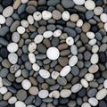 A collection of smooth, rounded pebbles arranged in a pattern with concentric circles. The stones Royalty Free Stock Photo