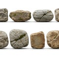 Collection of smooth, weathered stones isolated on white background Royalty Free Stock Photo