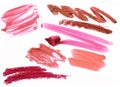 Collection of smudged lipsticks isolated on white.