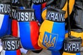 Collection of souvenir boxing gloves with country colours of Russia and Ukraine.