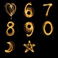 Collection of sparkler firework light alphabet number and sign. Royalty Free Stock Photo