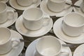 Empty cups and saucers with teaspoons.