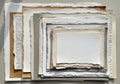 A collection of stacked torn-edge paper sheets of varying sizes Royalty Free Stock Photo