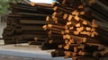 A collection of stacks of logs, blurred backgrounds