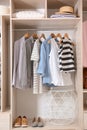 Collection of stylish clothes and shoes in large wardrobe Royalty Free Stock Photo