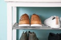 Collection of stylish shoes on rack storage Royalty Free Stock Photo