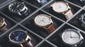 A collection of stylish wristwatches, arranged in a pattern, showcases the elegance of timepieces