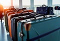 collection of suitcases and travel bags on a transport belt at the airport, bags of different styles, Royalty Free Stock Photo