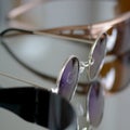 Collection of sunglasses on big reflection mirror Royalty Free Stock Photo